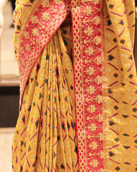 Buy Golden Yellow Designer Patola Saree With Pink Border