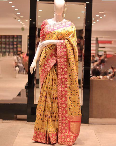 Golden Yellow Designer Patola Saree With Pink Border