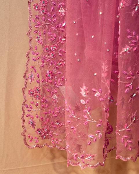 Radiant Pink Net Saree: A Blend of Opulence and Elegance