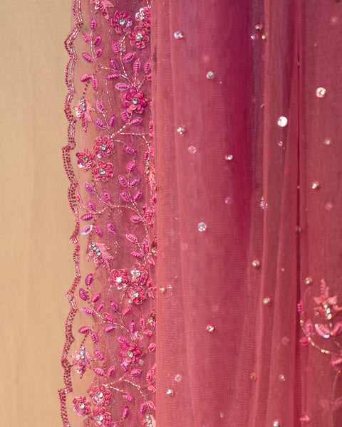 Radiant Pink Net Saree: A Blend of Opulence and Elegance