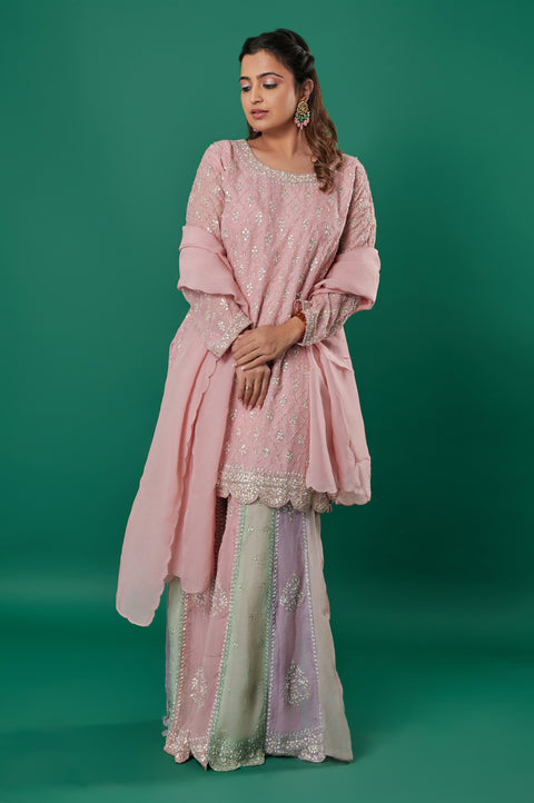 Creamy Peach Muslin Silk 3-Piece Sharara Suit with Heavy Stone Embroidered Kurta, Multicolored Embroidered Plazzo, and Dupatta